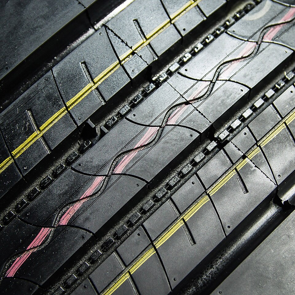 A close up view of the treads on a car tyre