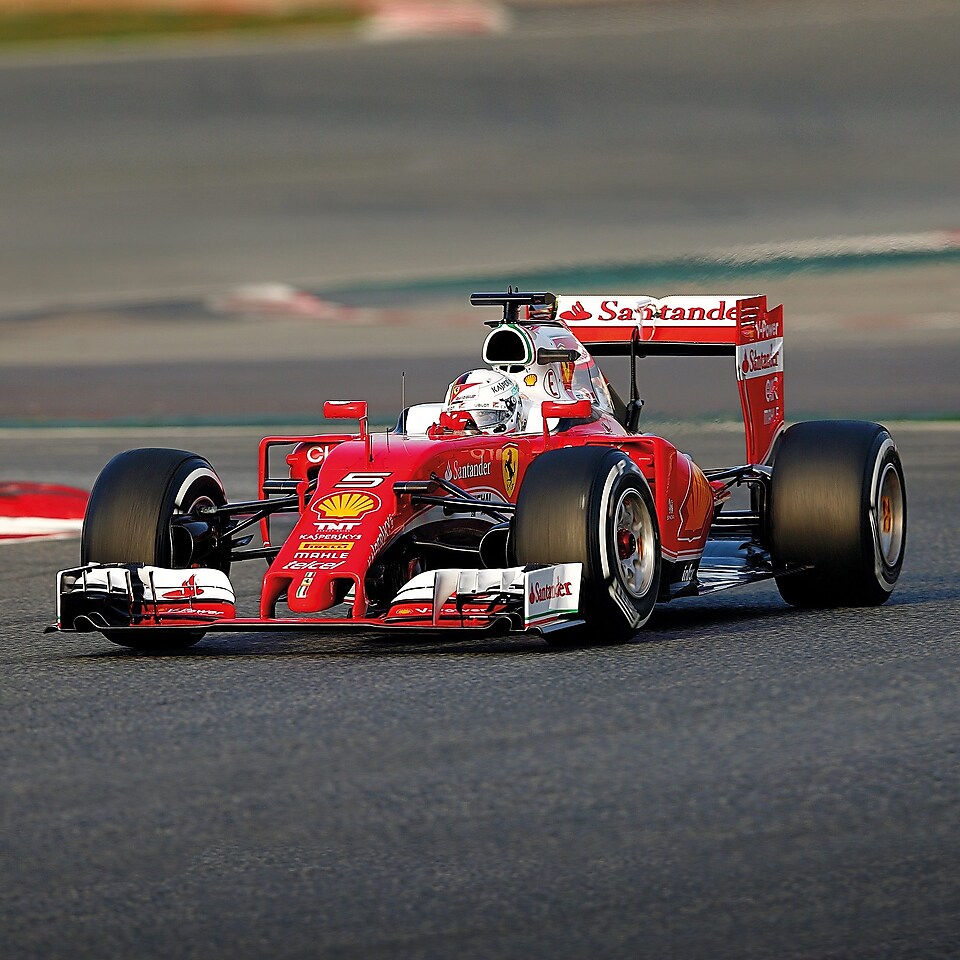 A red Scuderia Ferrari sits on a racing track, an example of Shell Helix Ultra’s Innovation Partnership