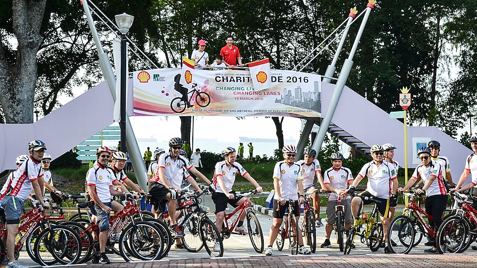 Shell staff, business associates and Lakeside Family Services members await the flag-off for their ride from the Road Safety Community Park to Gardens by the Bay and back.