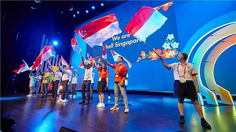 Our values: Shell Singapore employees with Singapore flag