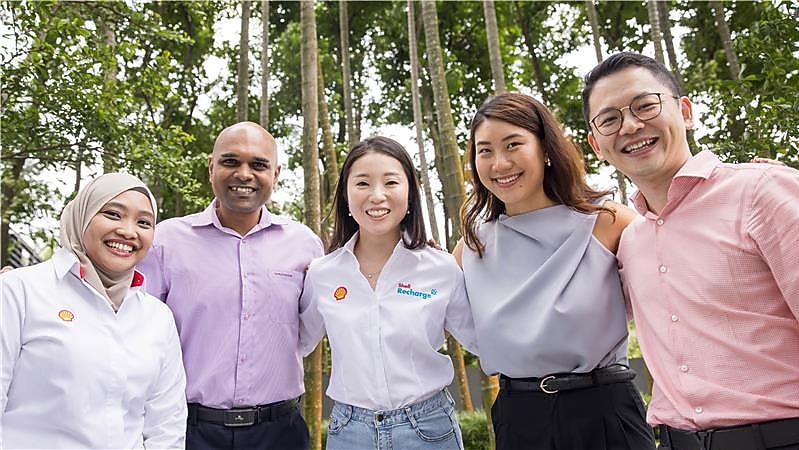 employees posing for a photo