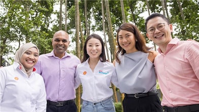 employees posing for a photo