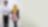 Employees walking and talking in corridor with iPad