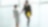 Businessman and businesswoman shaking hands in lobby