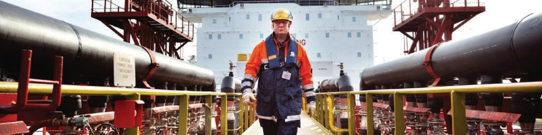 worker walking around a Shell vessel