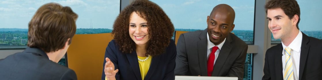 four shell employees in a meeting 