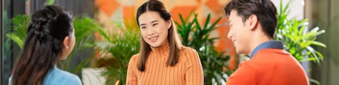 Shell employees smiling at a meeting