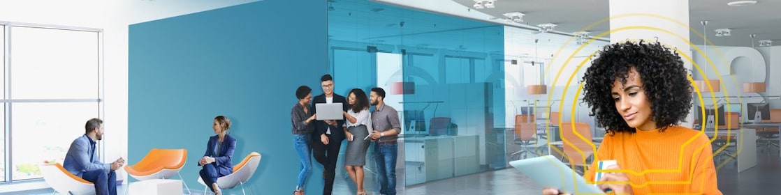Young female Shell employees smiling at a meeting
