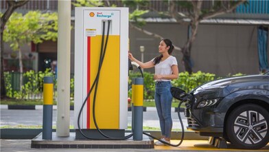 Woman at shell recharge