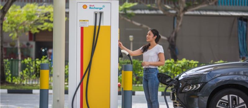 Woman at shell recharge