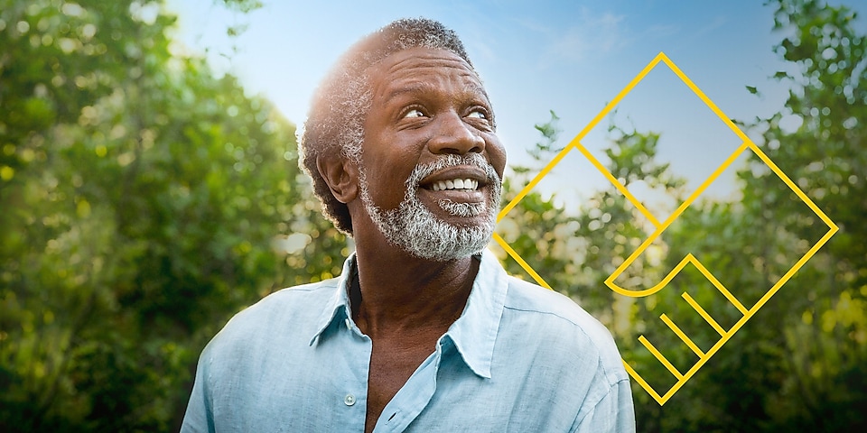 Smiling man with a beard in front of trees with an outline of the Generating shareholder value graph