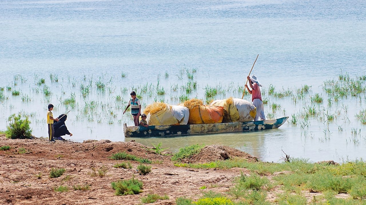 Local people on the Yabani Canal in the South of Iraq