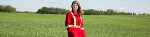 An employee stands in a field near a Quest CO2 injection well northeast of Edmonton, Alberta in Canada