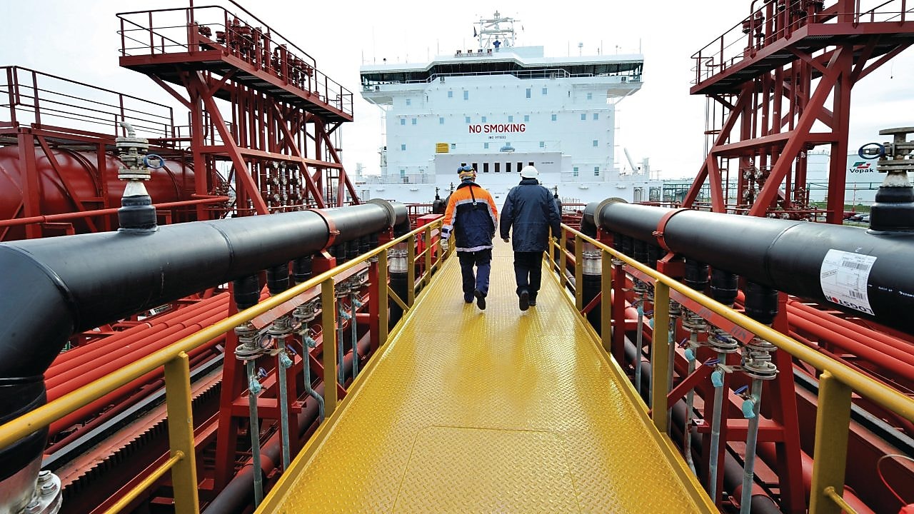 Shell employee walking along on a tanker