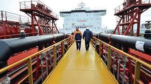 Shell employee walking along on a tanker