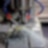 An oil drill being worked, and water being pumped onto it to help cool it down