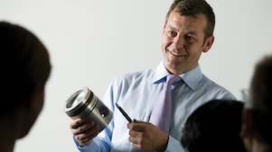 man presenting at a meeting