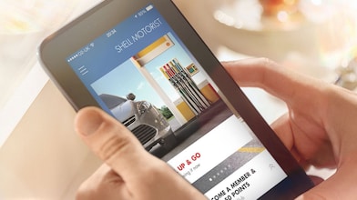 Man looking at the motorist app on the tablet