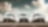 Three cars parked besides each other
