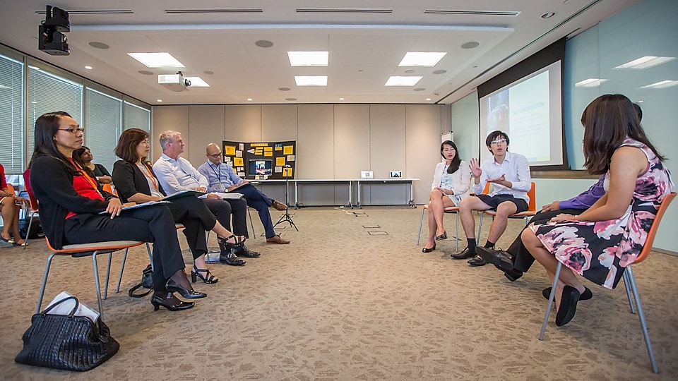 Group of students discussing in a conference room