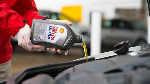 Shell Helix Ultra being poured into an engine
