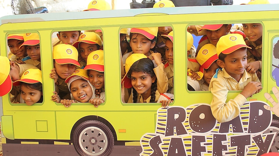 small kids wearing Shell's cap & smiling