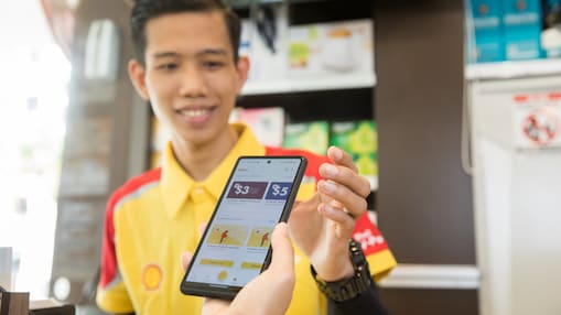 Image showing a customer scanning their phone at the till